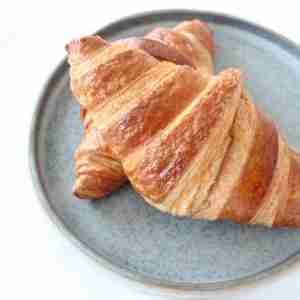 2 croissants on a plate