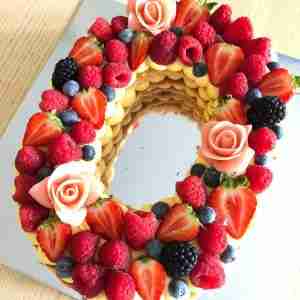 custom letter cake with fruit on top flo viennoiserie